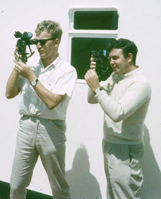 Two deck officers taking sights