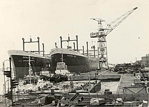 The two ships alongside in shipyard