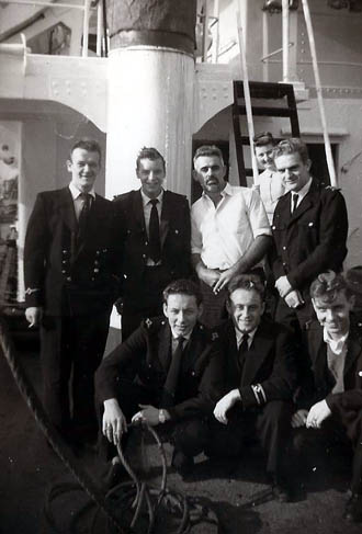 Officers on deck in blue uniform