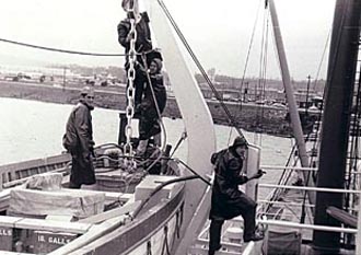 Four cadets working on lifeboat