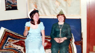 Two wives in bar with a drink