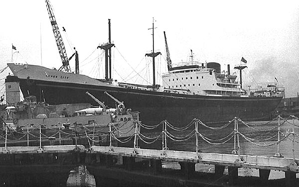 Devon City alongside