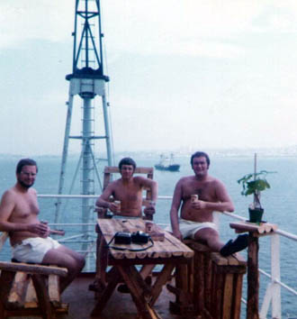 Three officers having a beer