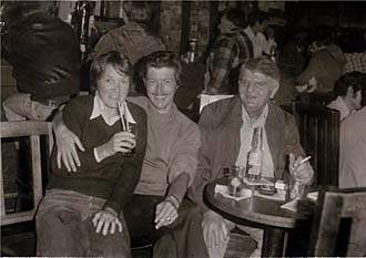 Three people in a bar