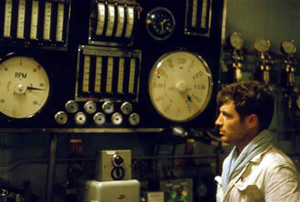 Ivor Skidmore looking at the engine control panel