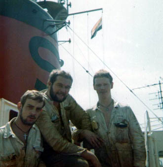 Three enginners with funnel as background