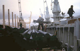 Loading deck cargo of deck pilings