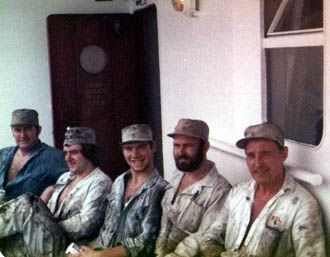 Five engineers in boiler suits